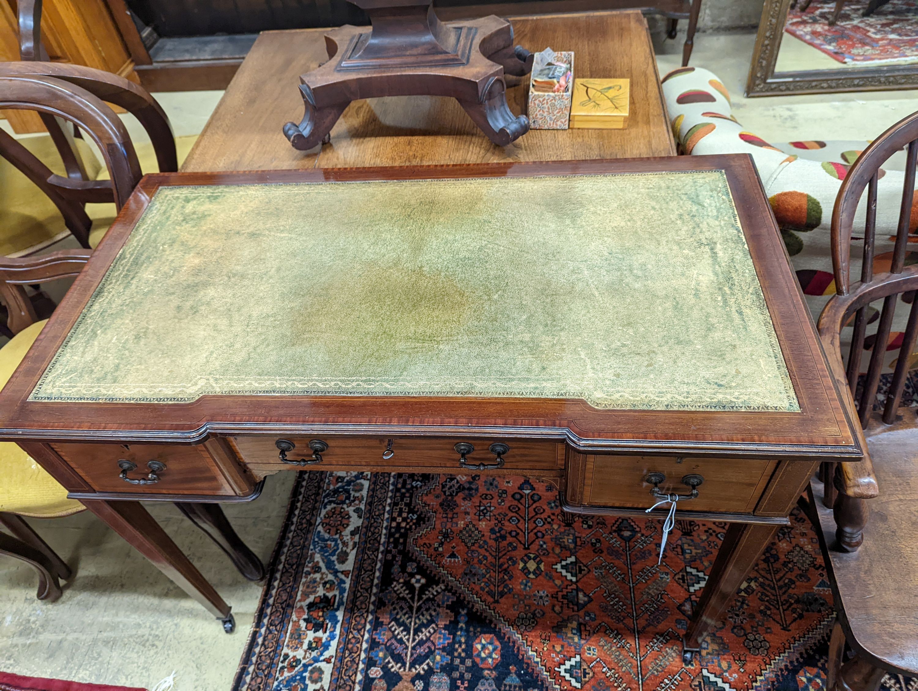 An Edwardian satinwood banded mahogany three drawer writing table, width 99cm, depth 53cm, height 75cm